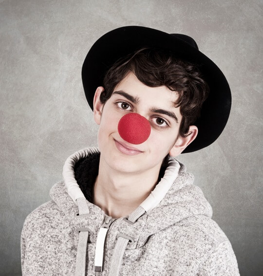 Boy with red clown nose